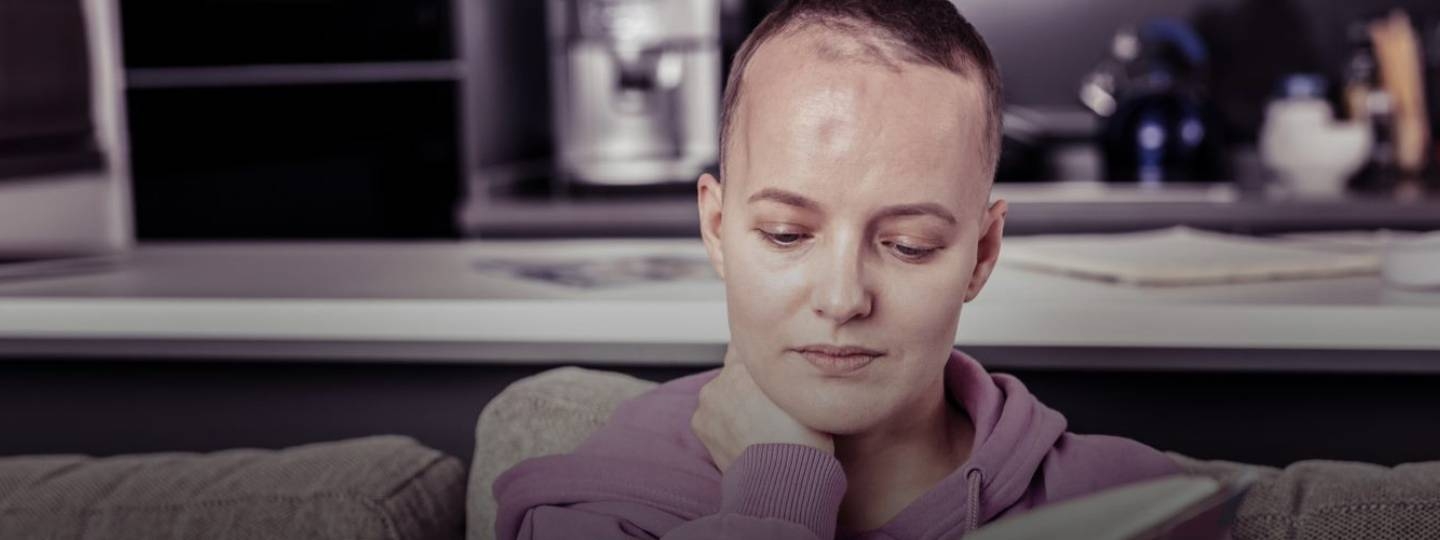 woman with head injury reading.