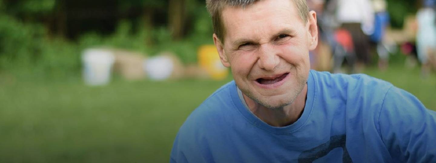 man smiling at camera.
