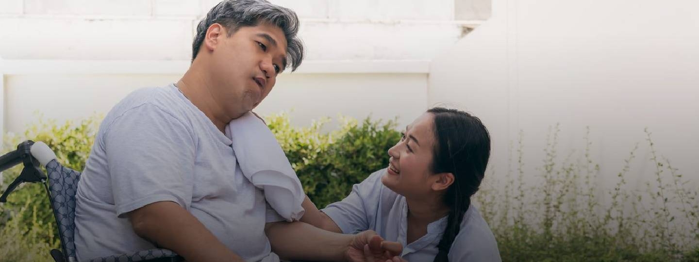 stroke patient and his carer.