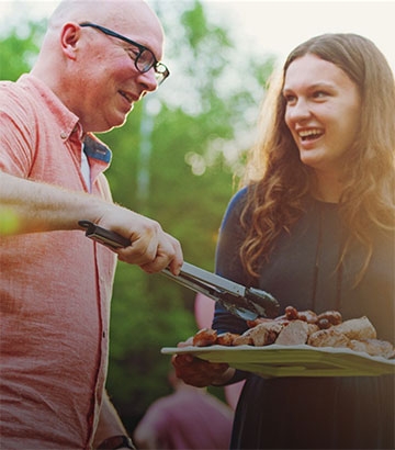 happy man and woman at a barbeque.
