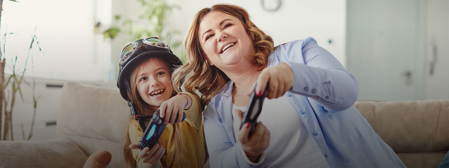 mother and daughter playing computer games