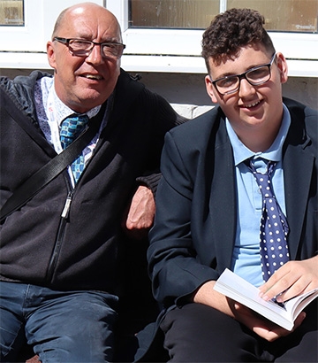 teacher and male student sat together