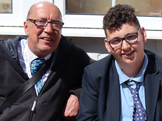 teacher and male student sat together
