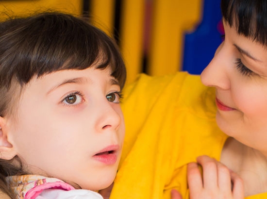 mother holding daughter