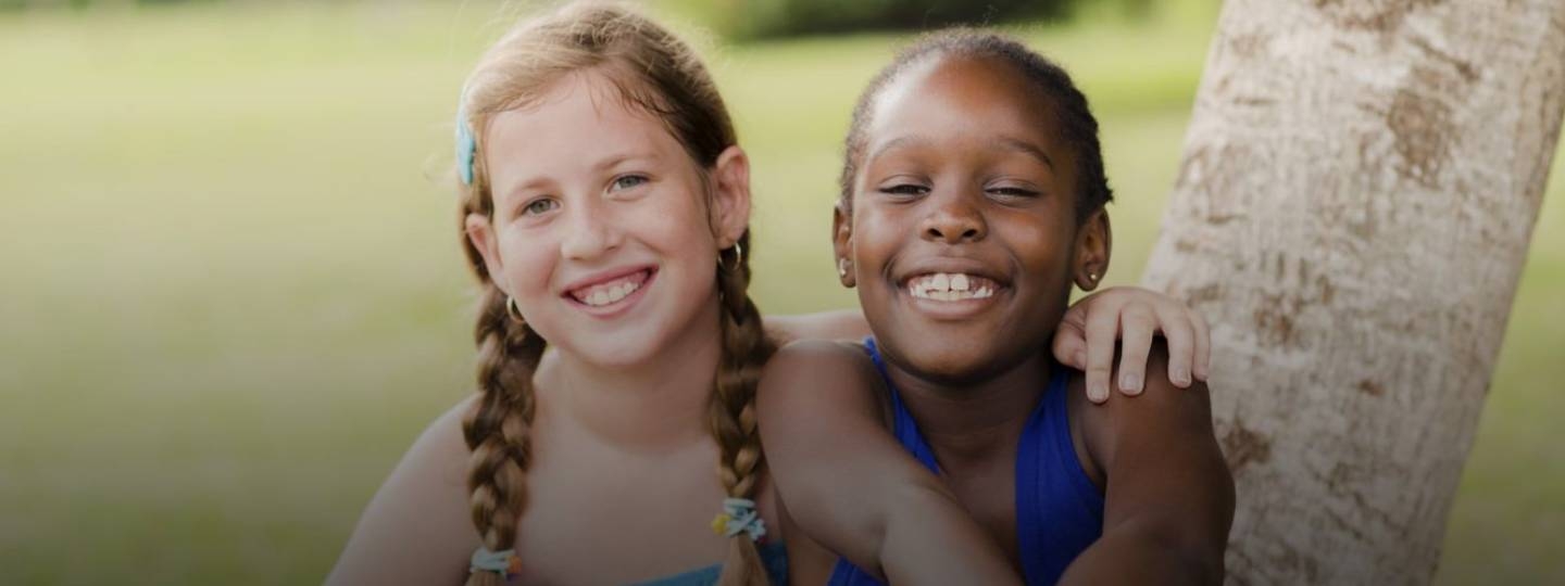 two young happy girls smiling