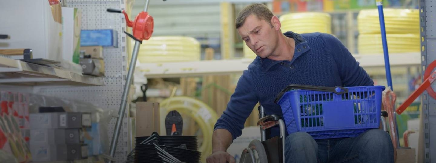 disabled man in wheelchair shopping.