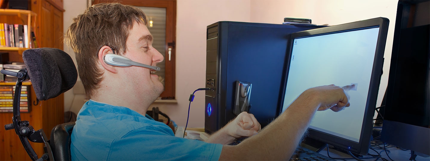 disabled man using specialist technology.
