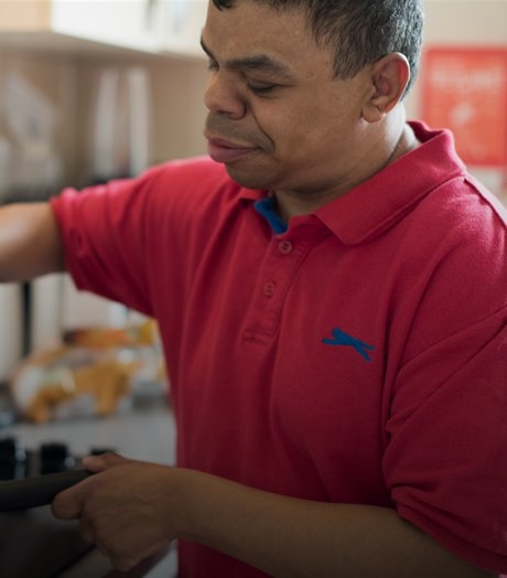 man cooking in a kitchen.